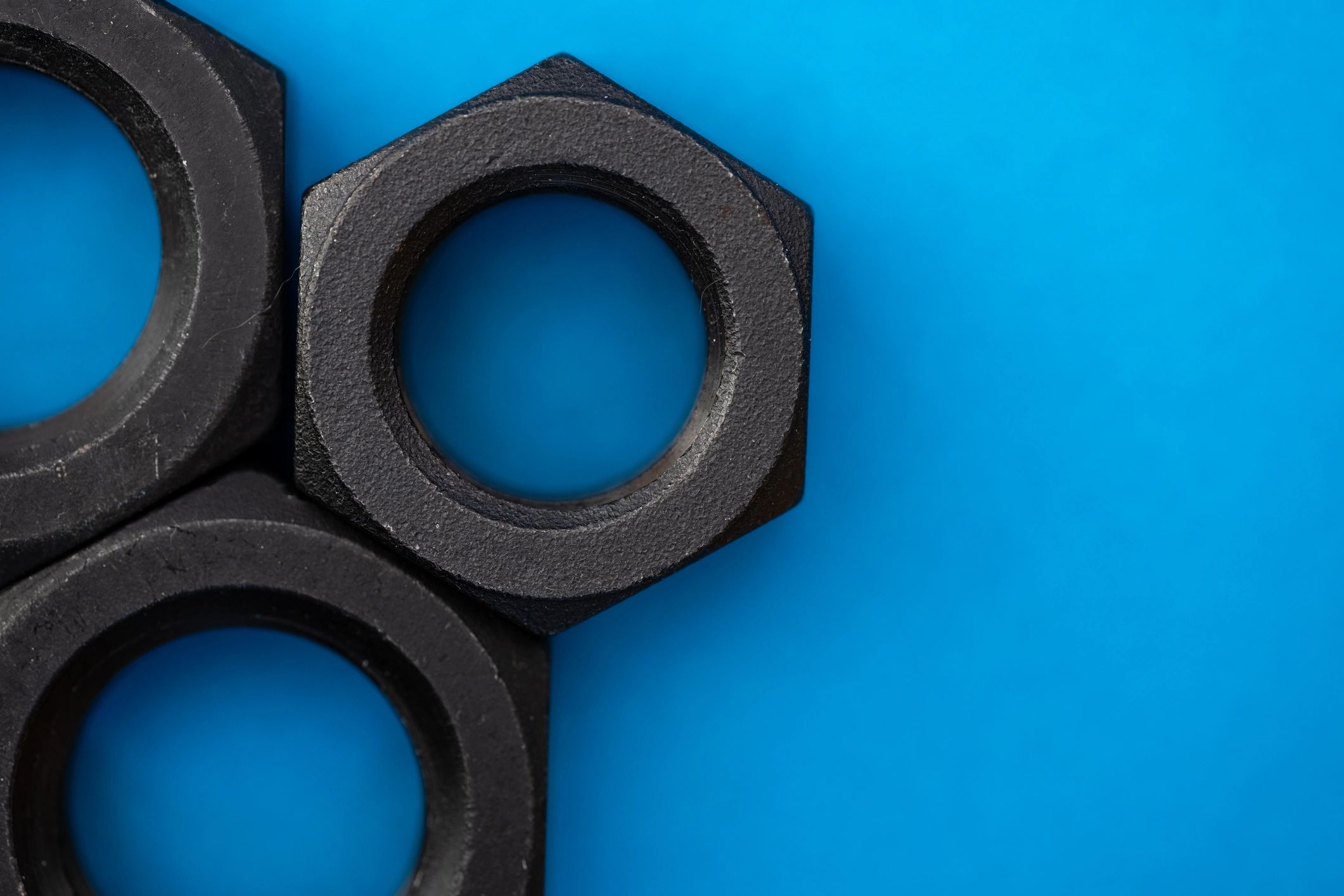 Hexagonal nuts arranged for industrial fastening context